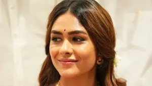 Mrunal Thakur smiling at a Bollywood event